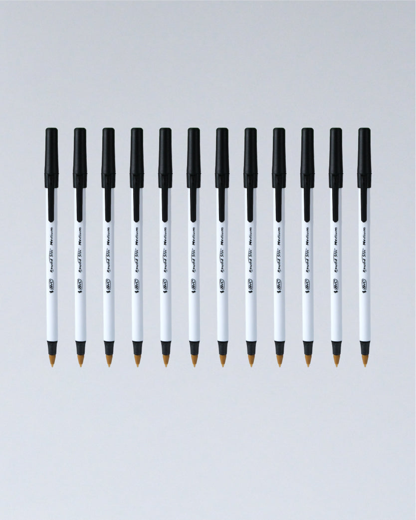 A row of ten Uni Fubon 0.5mm ballpoint pens with black caps and white barrels, arranged horizontally against a light gray gradient background.
