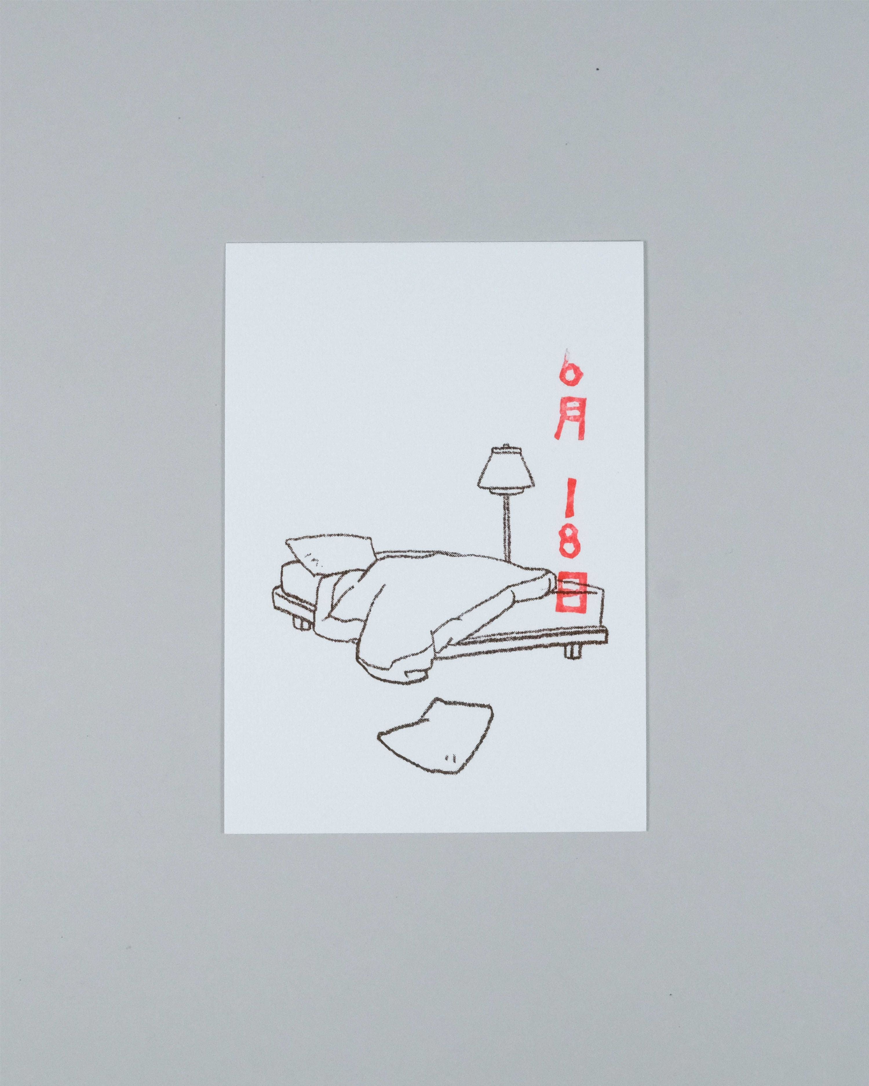 A minimalist art print featuring a black line drawing of a bed with a lamp and a broken piece of paper, with the date '6月18日' written in red on the right, displayed on a neutral gray background.