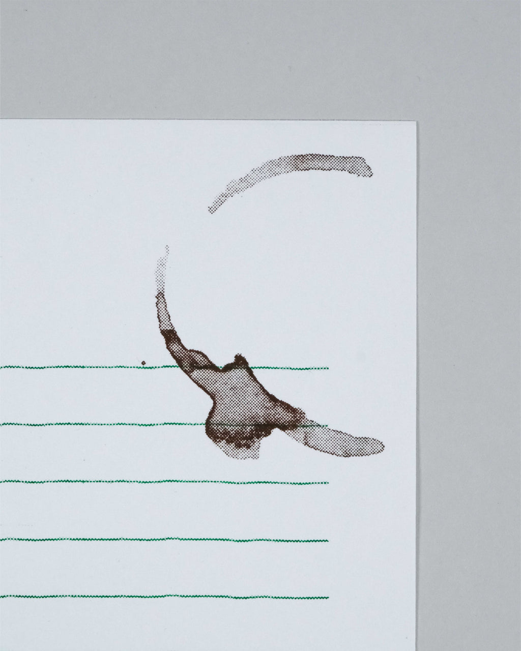 A square white art print or card featuring a minimalist abstract design: a brown ink-like splash or loop near the center, several thin green horizontal lines across the lower portion, and a light gray background around the print.