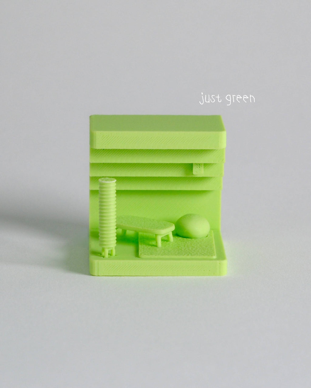 Green 3D-printed object on a light gray background with 'just green' text.