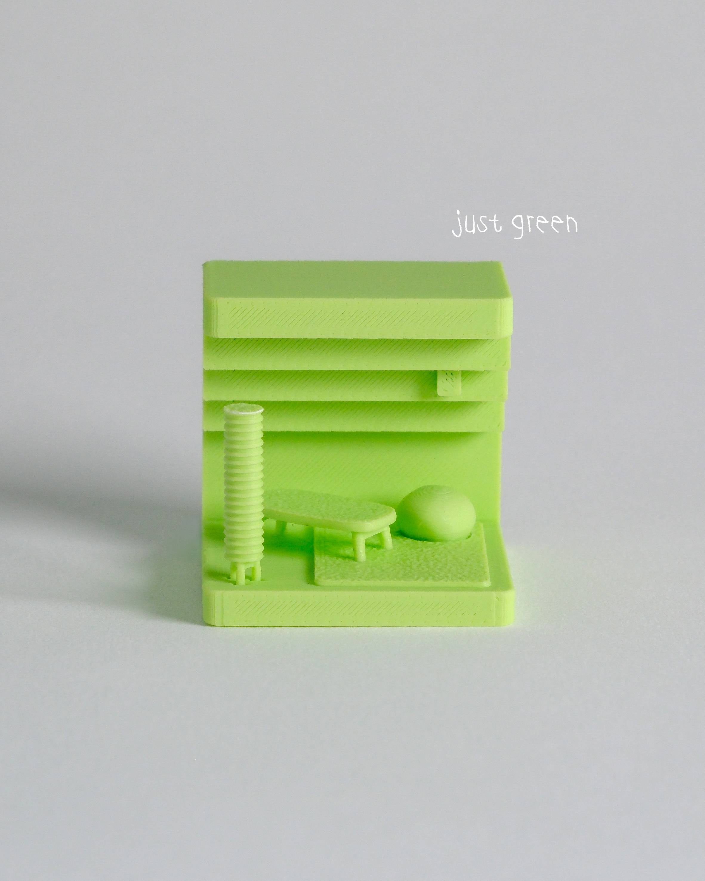 Green 3D-printed object on a light gray background with 'just green' text.