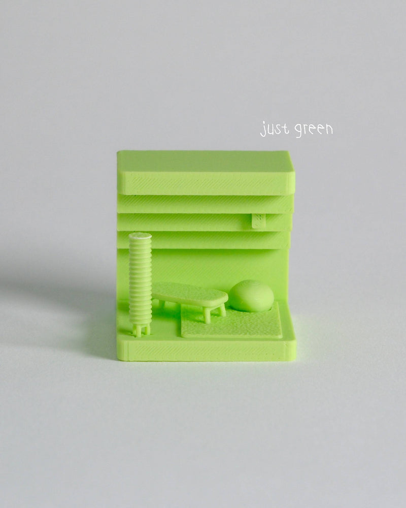 Green 3D-printed object on a light gray background with 'just green' text.